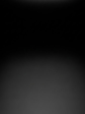 A completely black, dark background with a very subtle gradient to dark gray at the bottom, creating a deep, minimalist void.の素材