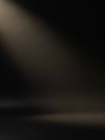 Stock showing dark studio background with a soft spotlight illuminating the scene from the upper left corner creating shadows and depth. resolutionの素材
