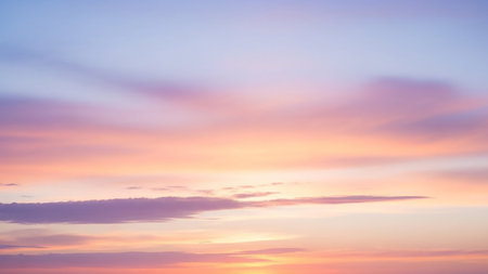 Stock showing delicate pastel hues of pink, orange, and lavender blend seamlessly across the sky during a serene sunset or sunrise with wispy clouds keywords:...の素材