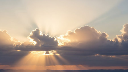 Bursting showing golden sun rays bursting through cumulus clouds in a sky with a subtle horizon line and a warm, uplifting mood. resolutionの素材
