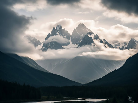 Jagged showing snow-capped mountain peaks piercing through soft, ethereal clouds with a dark evergreen forest and winding river in the foreground under a dramatic...の素材