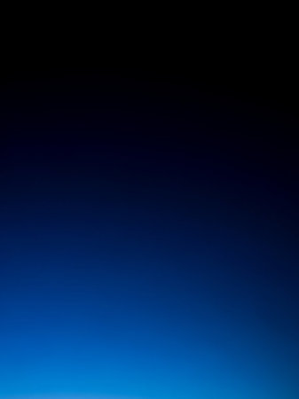 Stock showing smooth gradient of deep navy blue fading to bright electric blue at the bottom creating a clean and modern background. resolutionの素材