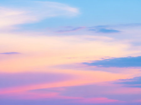 A serene sky filled with soft pastel clouds in shades of pink, orange, and blue, creating a gentle gradient effect.の素材