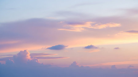 Purple showing soft pastel sky with wispy clouds in shades of pink purple and blue creating a dreamy and serene atmosphere during a gentle sunrise or sunset.の素材