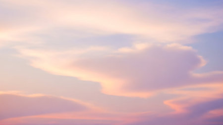 Ethereal showing soft focus pastel pink and lavender clouds gently blending in a hazy sky creating a dreamy and ethereal abstract background with subtle color...の素材