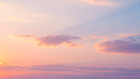 Rays showing soft pastel pink and blue sky filled with delicate wispy clouds and subtle sun rays creating a serene and dreamy atmospheric backdrop with a gentle...の素材