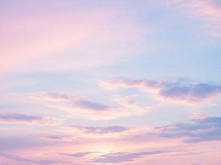 Lavender showing soft pastel sky at sunrise or sunset with delicate pink, lavender, and pale blue clouds creating a dreamy and tranquil ethereal atmosphere...の素材
