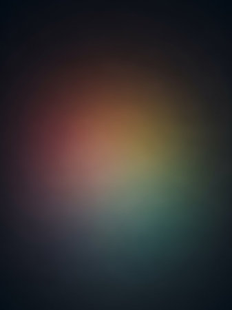 A softly blurred abstract background a smooth gradient of muted colors, transitioning from warm tones on the left to cooler tones on the right, fading into darkness.の素材