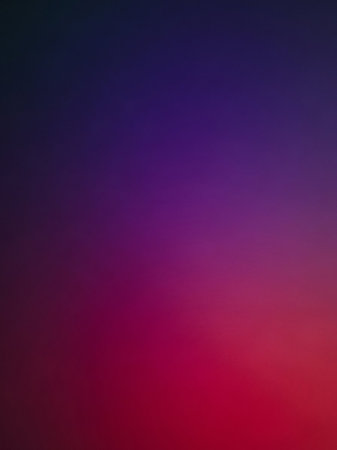 Blue showing a smooth, soft gradient transitioning from deep dark blue at the to vibrant fuchsia and red at the bottom, creating an abstract, moody, and atmospheric...の素材