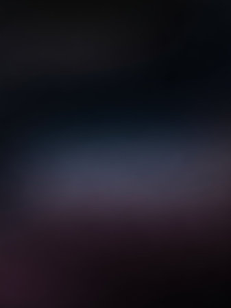 A deep dark blue and purple gradient background with a subtle blur effect, creating a smooth, abstract, and moody visual texture.の素材
