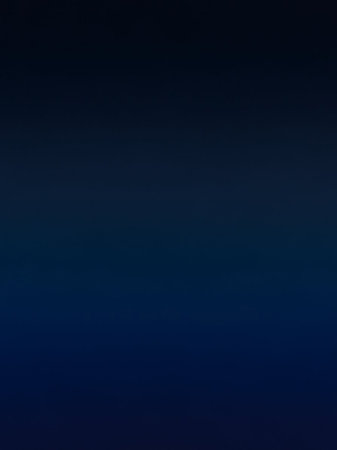 Dark showing a dark, deep blue gradient background with a subtle transition from a slightly lighter shade at the to a darker shade at the bottom, evoking depth...の素材