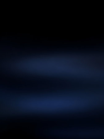 A dark navy blue abstract background subtle horizontal light streaks and soft gradients, evoking a deep, moody, and atmospheric feel.の素材