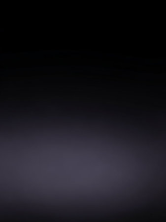 Simple showing dark gradient background transitioning from deep black at the to a soft muted purple and grey at the bottom with subtle light diffusion and smooth...の素材