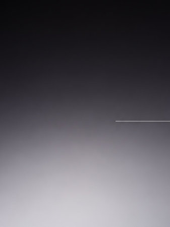 A smooth gradient transitions from dark gray to light gray and white, with a thin horizontal white line positioned on the right side for minimalist contrast.の素材