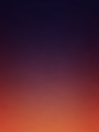 A smooth gradient background transitions from a deep indigo blue at the to a warm fiery orange red at the bottom, creating an abstract, atmospheric effect.の素材