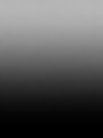 Black showing subtle vertical gradient from light gray to black with a faint textured surface for applications. resolution use.の素材