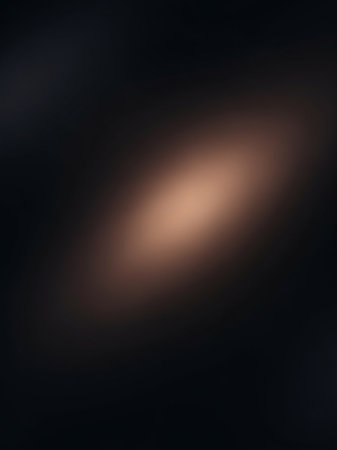 A dark, softly blurred background a luminous oval of warm golden brown light as a subtle, abstract focal point.の素材