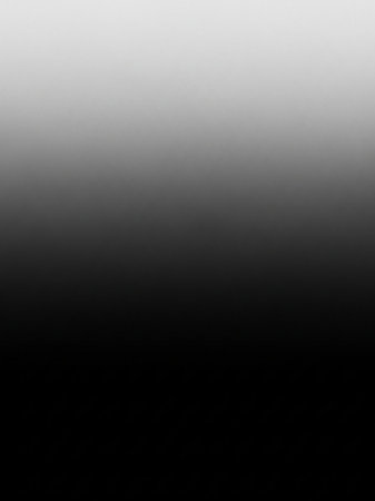 A smooth gradient transitions from solid black at the bottom to pure white at the with subtle gray tones in between.の素材