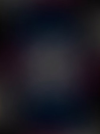 A softly blurred dark background subtle gradients of deep blue, purple, and gray, creating an atmospheric and abstract bokeh effect with smooth transitions.の素材
