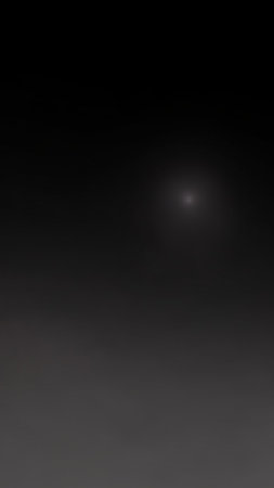 Fade showing subtle dark gray gradient background with a soft, diffused light source creating a gentle atmospheric effect for and creative projects keywords:...の素材