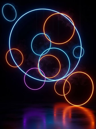 Several glowing neon circles and rings in blue, orange, and pink float in a dark, smoky atmosphere, with their reflections visible on a wet, dark floor.の素材