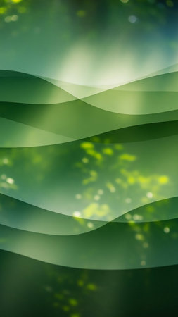 Abstract layered green wavy shapes overlap on a softly blurred green bokeh background, with diffused sunlight creating a serene, organic texture.の素材