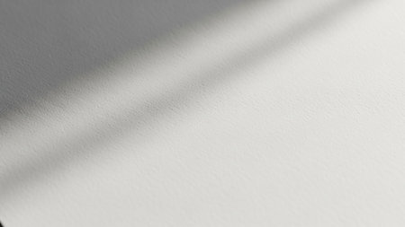 Keywords: showing close-up macro view of a textured white paper surface with soft diagonal shadows cast across it, creating a minimalist and clean aesthetic...の素材