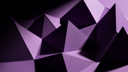 A close-up of a textured purple paper landscape with sharp geometric peaks and deep shadows, showcasing intricate folds and dramatic light.の素材