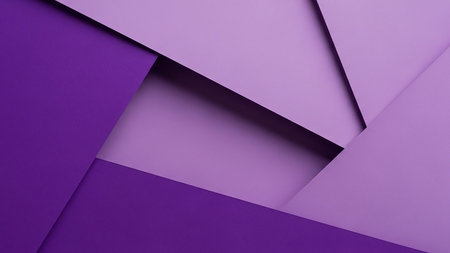 Overlapping planes of deep purple and lavender create a geometric abstract background with sharp angles, shadows, and a sense of depth.の素材