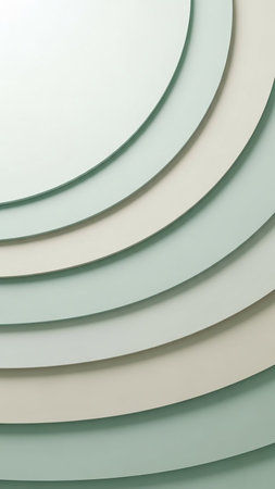 Abstract background composed of overlapping curved layers in soft pastel mint green and cream, creating a gentle concentric pattern with subtle shadows.の素材