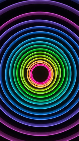 A vibrant rainbow colored neon light spiral forms concentric circles against a dark black background, emitting a glowing effect with a central void.の素材