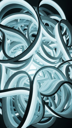 Ethereal showing an abstract and dynamic swirling pattern of luminous, translucent light blue and white ribbons creating a sense of depth and movement in a...の素材