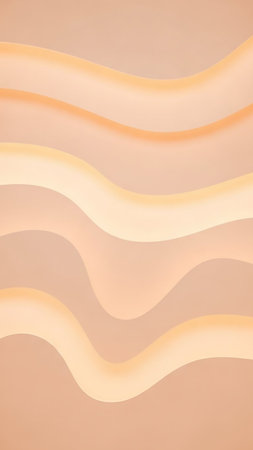 A serene abstract background featuring smooth, undulating waves in soft pastel shades of peach and creamy yellow, creating a gentle, calming visual flow.の素材