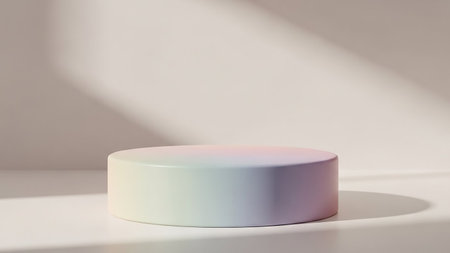 Product showing a minimalist cylindrical podium with a subtle pastel gradient of pink yellow and blue hues bathed in soft sunlight casting dappled shadows on a...の素材