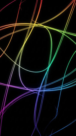 Vibrant rainbow colored light trails create a dynamic and chaotic abstract pattern against a stark black background, showcasing energy and motion.の素材