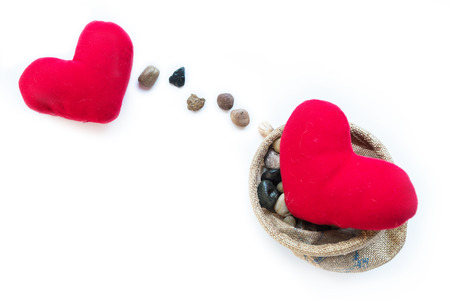 Two red pillow hearts, stones line present as sending, for Valentine day, happy New Year celebration, the meaning of love, warm feeling by sending the messages to someone the best wishes, and loveの写真素材
