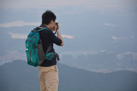 a male photographer taking photograph