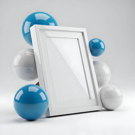 A white frame with a reflective surface is surrounded by several glossy blue and white spheres. The...