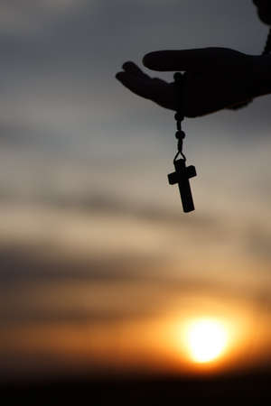 Black rosary at sunsetの写真素材