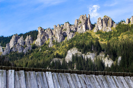 Wooden fence on the slope of the mountain in the Carpathiansの写真素材