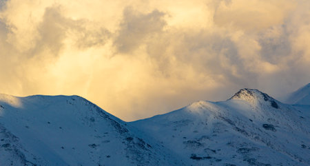 Snowy mountain peaks at sunset. Caucasus Mountains, Georgia, region Gudauri.の写真素材
