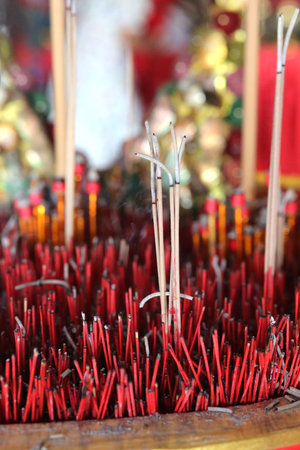 Incense sticks are burning and smoke