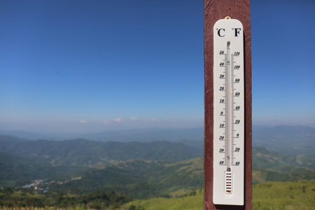 A THERMOMETER measures the air temperature.