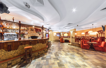 MOSCOW - DECEMBER 2014: Eastern interior of the uzbek restaurant. Bar of stone and wood. View of the main hall of the restaurant.のeditorial素材
