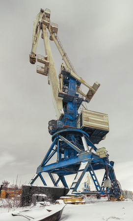 Cargo crane at night in winter.  Focus on the center craneの写真素材