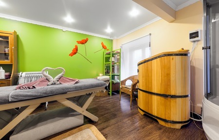 MOSCOW - APRIL 2015: Interior of luxury beauty salon Philosofiya Stilya. Massage room with mini sauna in a barrelのeditorial素材