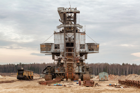 Many buckets of giant quarry excavator Equipment for the extraction of sand from the quarry. Front viewの写真素材