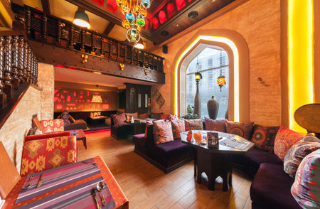 MOSCOW/RUSSIA - DECEMBER 2014. The restaurant's interior - CAMPUS in the east, Arabian style. The main dining room with tables, windows and oriental decorのeditorial素材