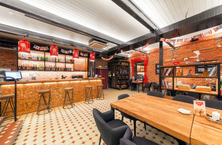 MOSCOW/RUSSIA - JANUARY 2015. Interior of the Russian farm restaurant "LAVKALAVKA". Wooden bar counterのeditorial素材