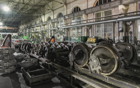 Wheel shop vehicle repair station. Many old wheelset standing on rail preparing to repairの写真素材